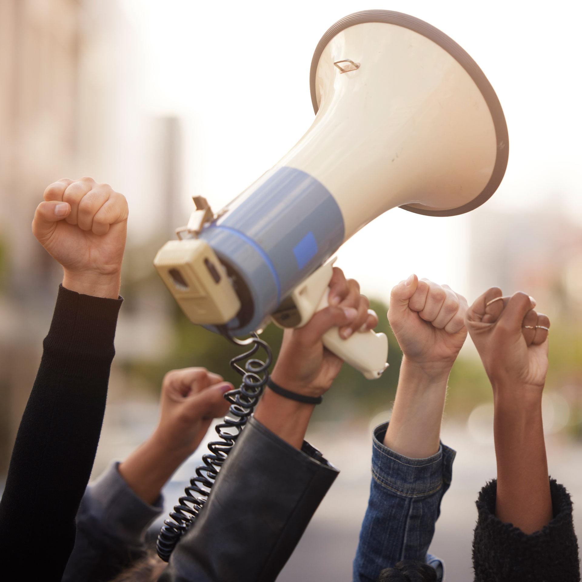 Hand and megaphone at a protest